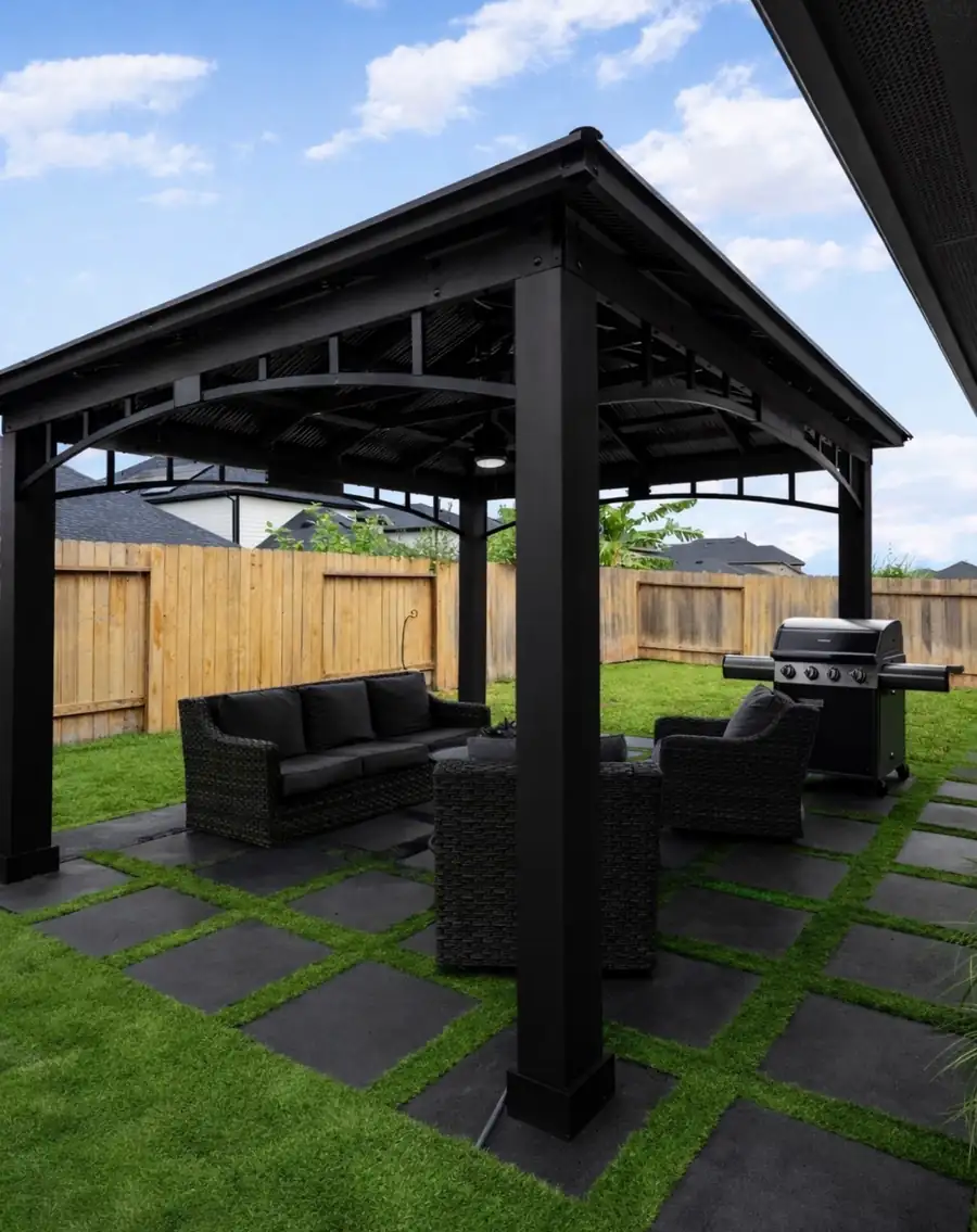 A gazebo over square pavers set in turf